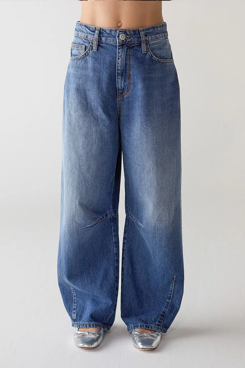 front profile model wearing Barrel fit Patriot Denim blue  with turquoise button closure