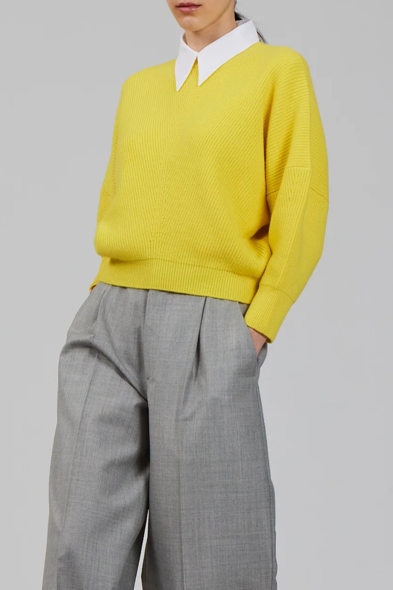 front profile model wearing Batwing Sweater Vivid Yellow Sculptural Batwing sleeve
Pure cashmere
Relaxed, cropped silhouette
Round neckline
Subtle ribbed trims at the cuffs and hem