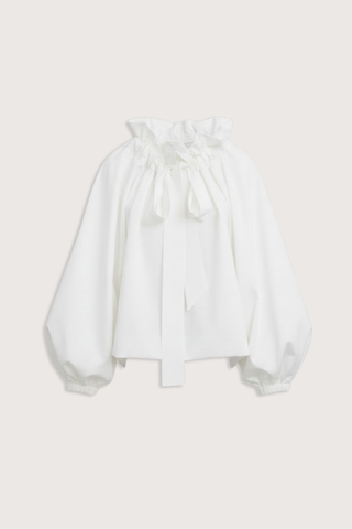 flat lay Beautiful Mess Top Cloud white Bow neck
puff sleeves
Grand ruffle neck cinched in with lovely wide ribbon
Long sleeve
Elastic cuff
Straight hem
100% Cotton
