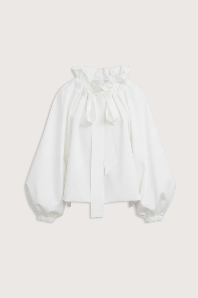flat lay Beautiful Mess Top Cloud white Bow neck
puff sleeves
Grand ruffle neck cinched in with lovely wide ribbon
Long sleeve
Elastic cuff
Straight hem
100% Cotton