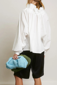 back profile model wearing Beautiful Mess Top Cloud white Bow neck
puff sleeves
Grand ruffle neck cinched in with lovely wide ribbon
Long sleeve
Elastic cuff
Straight hem
100% Cotton