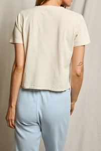 back profile model wearing Beckett Crispy Cotton V-Nk Tee Sugar 100% Cotton
Relaxed boxy fit
V-neck silhouette