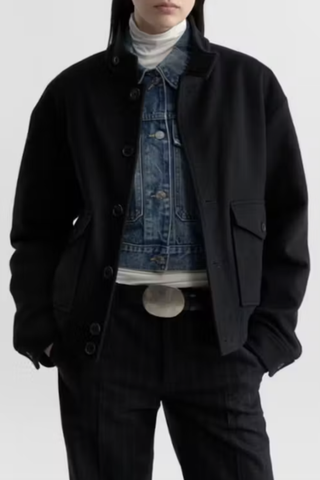 front profile model wearing Belleville Bomber black Ribbed hem and collar
Patch pockets with buttons and side entry
Buttons at front and cuffs. Two internal pockets
Fully lined
100% Virgin Wool