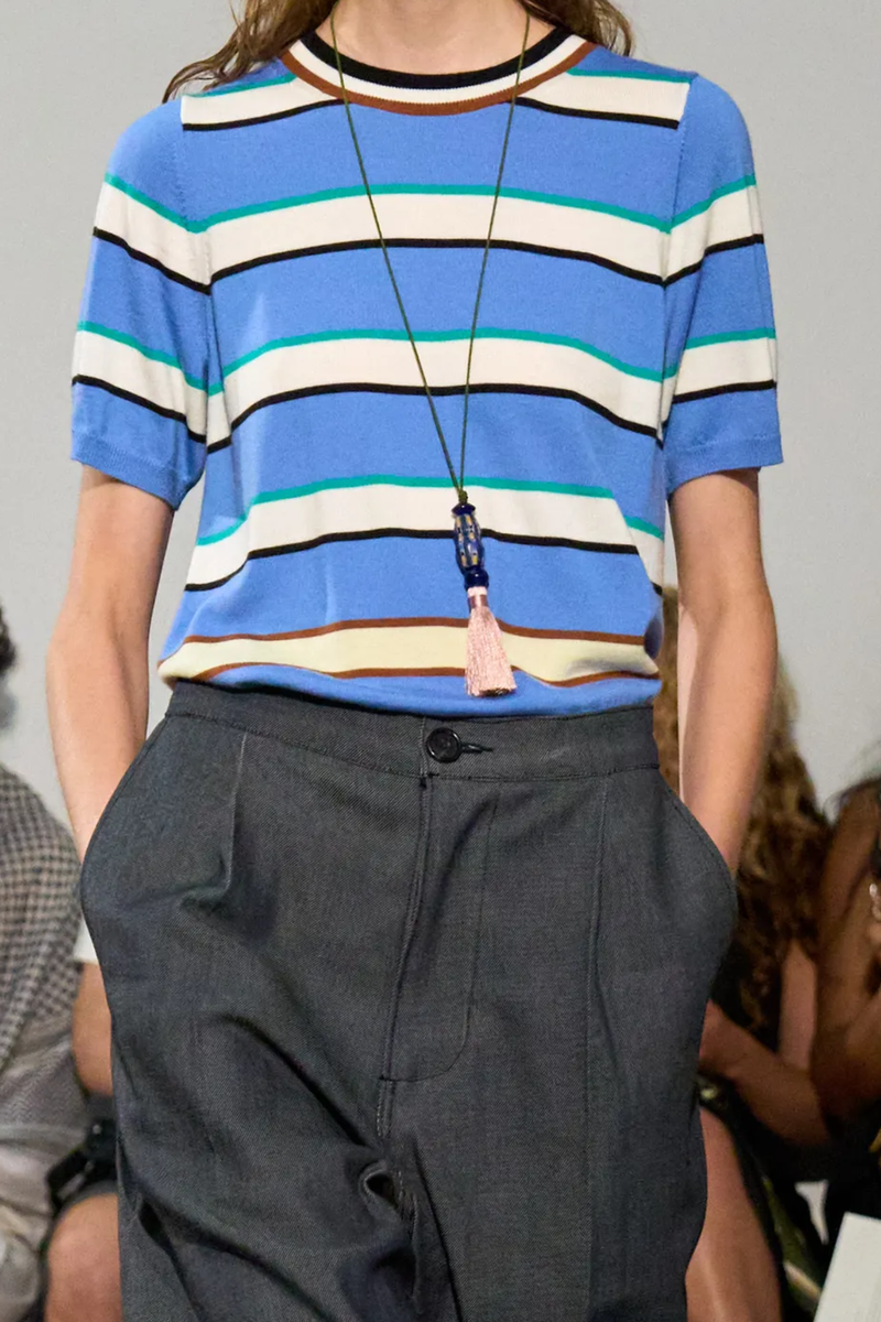 front profile model wearing Benji Merino  Striped Short Sleeve Top hyacinth blue green yellow red combo Wool
Crewneck
Ribbed cuff and hem
Stripe print