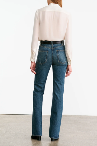 back profile model wearing Bertille Ruffle Shirt IvoryRuffle on collar and button closure
Long sleeve silk ivory