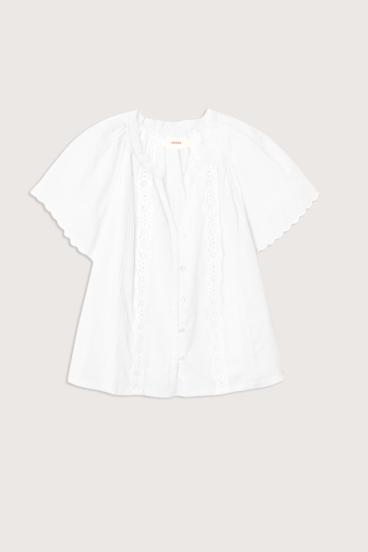 flat lay Bianca Cotton Short Sleeve Top white Superfine cotton voile
Button-front blouse
Split neck
Flutter sleeves
Scalloped trim
Pintuck detailing
Eyelet insets
Calista Cotton
100% Cotton