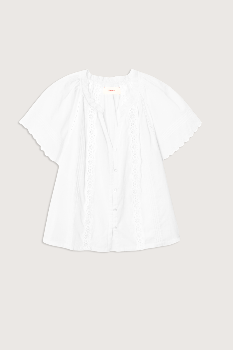 flat lay Bianca Cotton Short Sleeve Top white Superfine cotton voile
Button-front blouse
Split neck
Flutter sleeves
Scalloped trim
Pintuck detailing
Eyelet insets
Calista Cotton
100% Cotton
