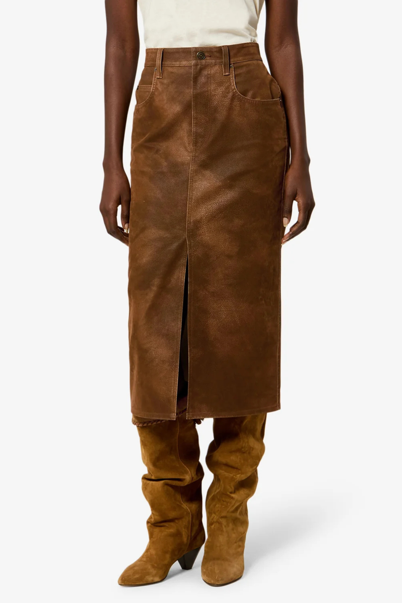 front profile model wearing Bisane Pencil Faux Suede Skirt brown Faux suede midi skirt with a distressed finish
Mid-rise
Front closure with hidden zip fly 
Waistband with belt loops
Front slit
Embossed "Isabel Marant" leather patch at the back
Polyester 100%