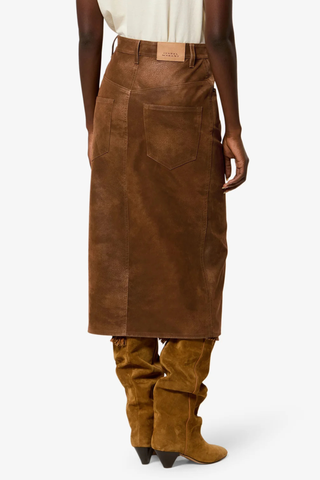 back profile model wearing Bisane Pencil Faux Suede Skirt brown Faux suede midi skirt with a distressed finish
Mid-rise
Front closure with hidden zip fly 
Waistband with belt loops
Front slit
Embossed "Isabel Marant" leather patch at the back
Polyester 100%