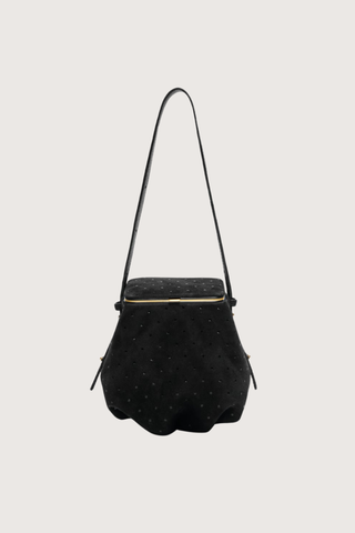 front profile Blaine Short Strap Bag Black Suede Pouch style bag
Single latch closure
Voluminous pleated pouch
Adjustable strap in nappa leather
Italian suede with applied mini-dots
24k gold-plated hardware
