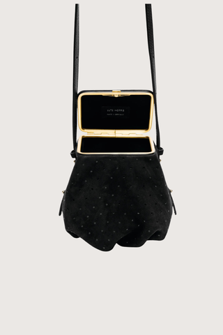 open detail Blaine Short Strap Bag Black Suede Pouch style bag
Single latch closure
Voluminous pleated pouch
Adjustable strap in nappa leather
Italian suede with applied mini-dots
24k gold-plated hardware

