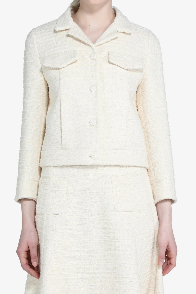 front profile model wearing Boucle Jacket Cream Cream bouclé jacket
Button-front closure
Classic collar
Straight-fit design
Long&nbsp;3/4 sleeves
Front pockets
Traditional finish
Classic construction