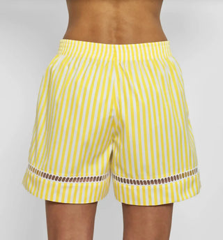 back profile model wearing Boxer With Embroidered Hem Shorts yellow white vertical stripe Venetian boxer
Hemstitch embroidery
Straight leg
Mid-rise
Relaxed fit
Elasticated at the waist
Yellow and white vertical stripe
Mother-of-pearl buttona
Medium weight cotton
100% two-ply cotton poplin woven in Italy