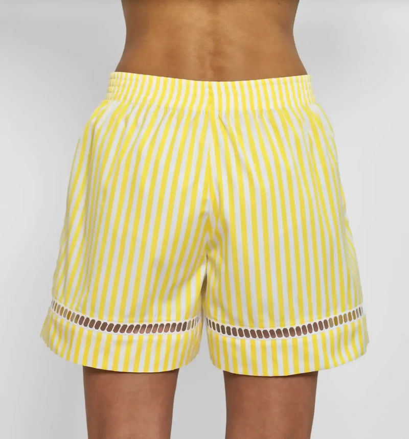 back profile model wearing Boxer With Embroidered Hem Shorts yellow white vertical stripe Venetian boxer
Hemstitch embroidery
Straight leg
Mid-rise
Relaxed fit
Elasticated at the waist
Yellow and white vertical stripe
Mother-of-pearl buttona
Medium weight cotton
100% two-ply cotton poplin woven in Italy