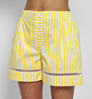 front profile model wearing Boxer With Embroidered Hem Shorts yellow white vertical stripe Venetian boxer
Hemstitch embroidery
Straight leg
Mid-rise
Relaxed fit
Elasticated at the waist
Yellow and white vertical stripe
Mother-of-pearl buttona
Medium weight cotton
100% two-ply cotton poplin woven in Italy