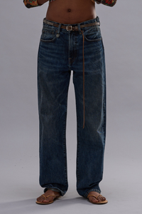 front profile model wearing Boyfriend Jean Rigid Renegade Blue Straight-leg boyfriend fit
Mid-weight Japanese rigid denim
100% cotton + 100% COW LEATHER PATCH