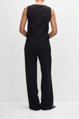 back profile model wearing Broderie Tie Top black Delicate floral broderie
Scalloped hem finish
Open tie front
Sleeveless Blouse
100% Cotton