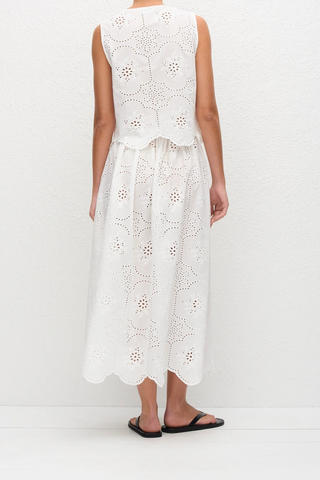 back profile model wearing Broderie Tie Top white Delicate floral broderie
Scalloped hem finish
Open tie front
Sleeveless Blouse
100% Cotton