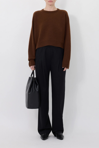 front profile model wearing Bruzzi Sweater Brown wool cashmere crewneck drop shoulders cropped fit