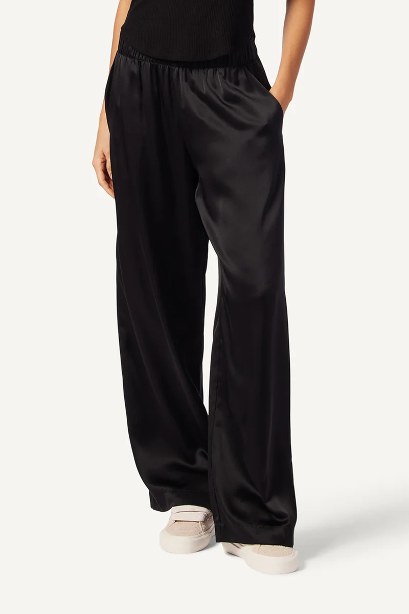 model wearing Brynn Wide Leg Silk Pant Black with elastic waist
