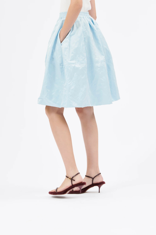 side profile model wearing Bubble Crinkle Satin Skirt ceil blue Bubble skirt
Elastic waistband
Decorative stitching
Side seam pockets