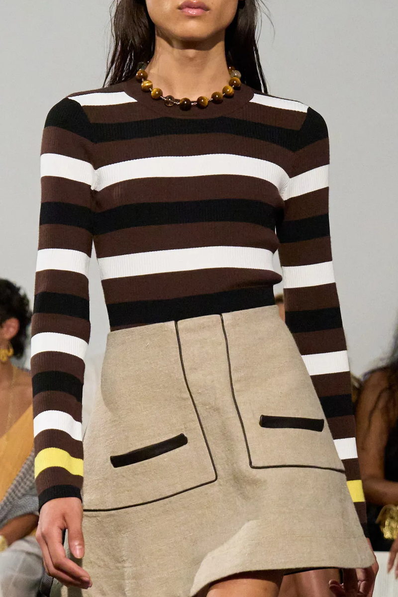 front profile model wearing Cadanet Merino Long Sleeve Striped Top Crewneck
Long sleeve
Contrast white, black, brown and yellow horizontal stripe
Ribbed

100% merino wool