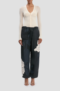front profile model wearing Cargo Print Trouser navy rose pink Printed viscose twill fabrication
Utilitarian cargo style
Elasticated waistband with waist ties
Leg cuffs with ties
Irregular pocket design
Back welt pocket with contrast stitching