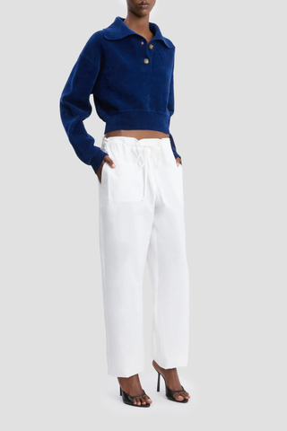 side profile model wearing Cargo Print Trouser White Printed viscose twill fabrication
Utilitarian cargo style
Elasticated waistband with waist ties
Leg cuffs with ties
Irregular pocket design
Back welt pocket with contrast stitching