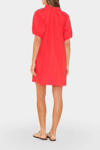 back profile model wearing Carleigh Ruffle Neck Dress Red cotton Crisp paper poplin with a refined feel
Mini dress
Deep V-neck
Ruffle detailing
Shirred puff sleeves
Side seam pockets