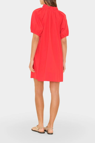 back profile model wearing Carleigh Ruffle Neck Dress Red cotton Crisp paper poplin with a refined feel
Mini dress
Deep V-neck
Ruffle detailing
Shirred puff sleeves
Side seam pockets