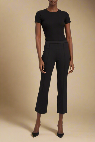 front profile model wearing Casanoca Ankle Flare Pant With Pinktucks