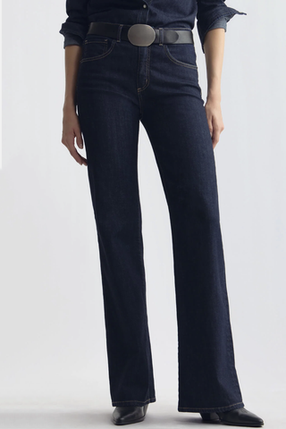 front profile model wearing  Celina Jean Indigo Rinse Classic five-pocket
Premium Japanese stretch denim
Mid-to-high-rise
Flare leg
Fits close through the waist and hips before opening into a soft elongating flare
98% Cotton, 2% Polyurethane
