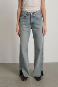 front profile model wearing Charlot Split Hem Jean (Inseam 29") ed wash light blue wash Mid rise
Relaxed fit
Sitting just below the natural waist
Full length inseam
Clean fit that breaks from the high hip
Straight leg
Split hem cotton