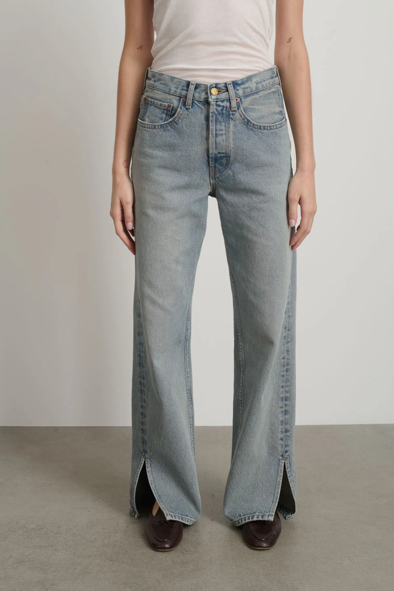 front profile model wearing Charlot Split Hem Jean (Inseam 29") ed wash light blue wash Mid rise
Relaxed fit
Sitting just below the natural waist
Full length inseam
Clean fit that breaks from the high hip
Straight leg
Split hem cotton