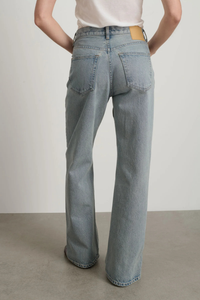 back profile model wearing Charlot Split Hem Jean (Inseam 29") ed wash light blue wash Mid rise
Relaxed fit
Sitting just below the natural waist
Full length inseam
Clean fit that breaks from the high hip
Straight leg
Split hem cotton