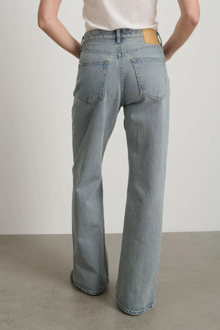 back profile model wearing Charlot Split Hem Jean (Inseam 29") ed wash light blue wash Mid rise
Relaxed fit
Sitting just below the natural waist
Full length inseam
Clean fit that breaks from the high hip
Straight leg
Split hem cotton