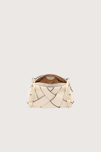 inside view of Charlotte Camera Bag Cowrie cowrie white
Hand-woven
Thick tubular strap
Worn crossbody or on the shoulder
Suede interior
Calfskin nappa leather
Hammered antique brass sliders
Zipper along top