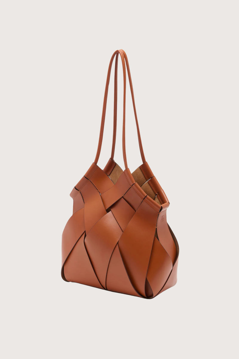 side profile  Charlotte Shoulder Bag sierra brown basket weaving style
Hand-painted edges
Internal suede-lined
Tubular straps
Smooth calfskin leather
Hammered brass toggle at the top