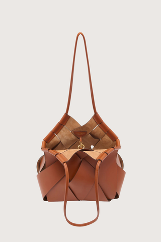 inside view of  Charlotte Shoulder Bag sierra brown basket weaving style
Hand-painted edges
Internal suede-lined
Tubular straps
Smooth calfskin leather
Hammered brass toggle at the top