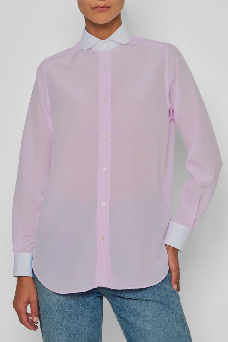 front profile model wearing Chemise De Garcon Shirt pink and white Rounded collar
Pale pink silk crêpe-de-chine
Silk base, contrasted by the crisp white cotton poplin collar and cuffs
Straight cut - classic fit
Back yoke with pleat
Square cuff
Mother-of-pearl buttons
90% silk crepe de chine/10% two-ply cotton poplin