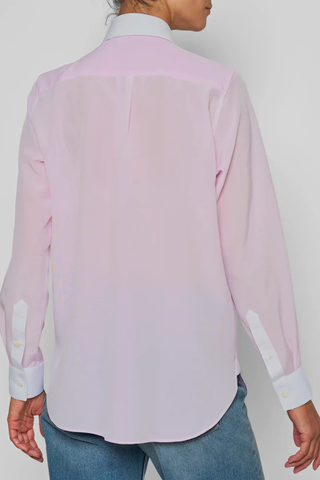 back profile model wearing Chemise De Garcon Shirt pink and white Rounded collar
Pale pink silk crêpe-de-chine
Silk base, contrasted by the crisp white cotton poplin collar and cuffs
Straight cut - classic fit
Back yoke with pleat
Square cuff
Mother-of-pearl buttons
90% silk crepe de chine/10% two-ply cotton poplin
