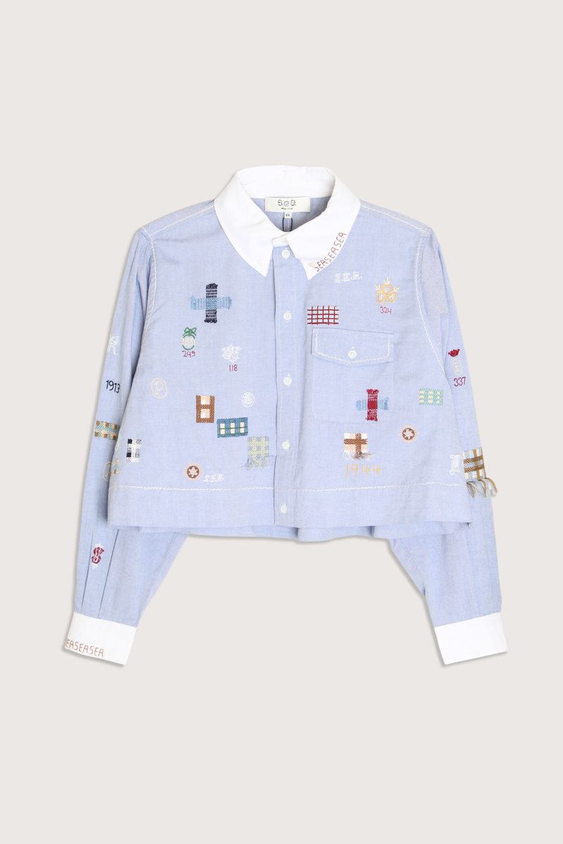 flat lay Claira Embroidered Button Down light blue Long sleeve shirt
Cropped oxford button-down
Contrasting collar and cuffs
Detailed embroidery 100% cotton