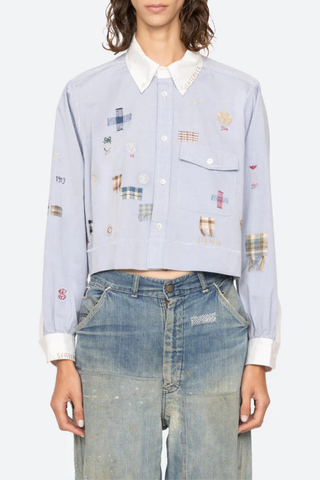 front profile model wearing Claira Embroidered Button Down light blue Long sleeve shirt
Cropped oxford button-down
Contrasting collar and cuffs
Detailed embroidery 100% cotton