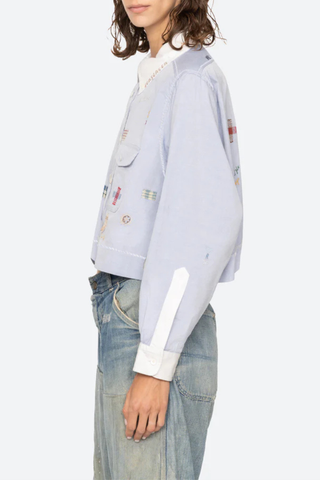 side profile model wearing Claira Embroidered Button Down light blue Long sleeve shirt
Cropped oxford button-down
Contrasting collar and cuffs
Detailed embroidery 100% cotton