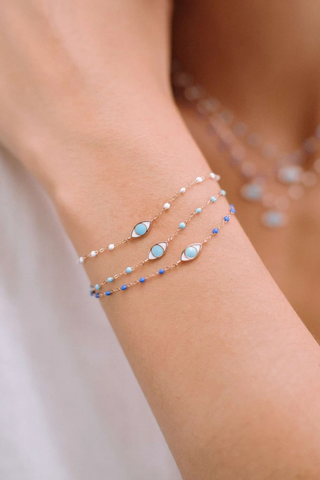 model wearing Classic Eye Bracelet 6.7" 18K Yellow Gold Turquoise resin pearls
6.7" with adjustabe clasp at 6.3"
