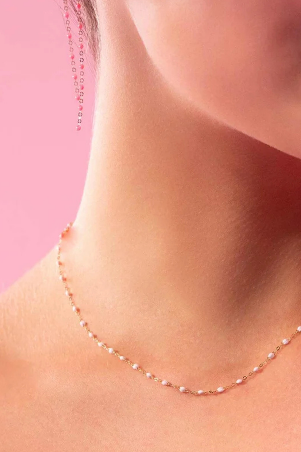 model wearing Classic Gigi Necklace 16.5" 18K Yellow Gold Baby Pink Baby Pink resin jewels
varying 16.5" options and solid black jewels
16.5" chain with adjustable clasp at 16.1"