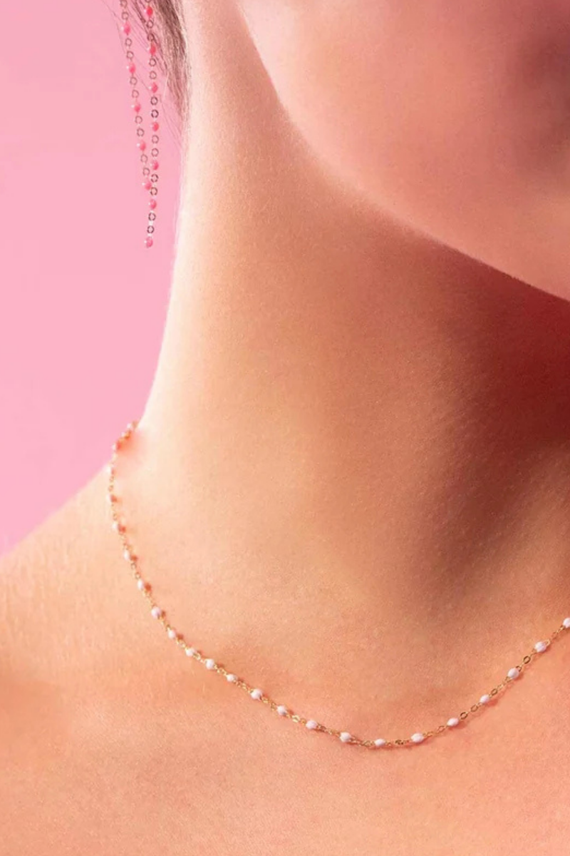 model wearing Classic Gigi Necklace 16.5" 18K Yellow Gold Baby Pink Baby Pink resin jewels
varying 16.5" options and solid black jewels
16.5" chain with adjustable clasp at 16.1"