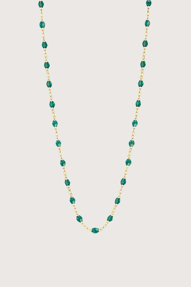 flat lay Classic Gigi Necklace 16.5" 18K Yellow Gold Emerald Emerald resin jewels
varying 16.5" options and solid black jewels
16.5" chain with adjustable clasp at 16.1"