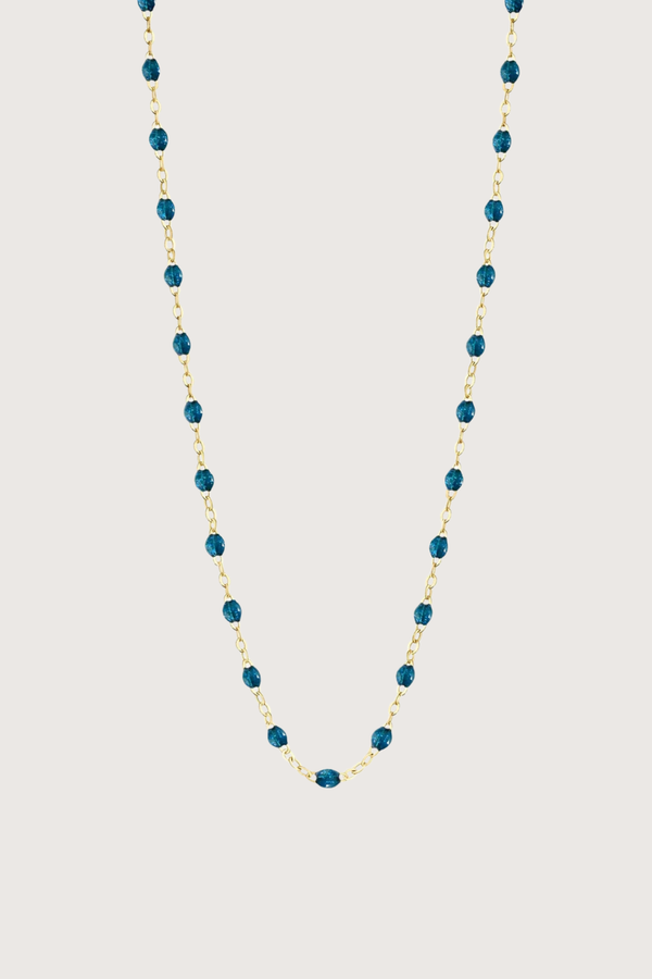 flat lay Classic Gigi Necklace 16.5" 18K Yellow Gold Jungle Jungle blue resin jewels
varying 16.5" options and solid black jewels
16.5" chain with adjustable clasp at 16.1"