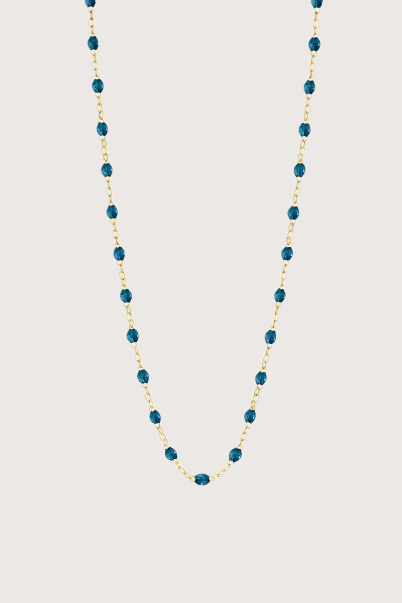 flat lay Classic Gigi Necklace 16.5" 18K Yellow Gold Jungle Jungle blue resin jewels
varying 16.5" options and solid black jewels
16.5" chain with adjustable clasp at 16.1"